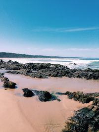 Scenic view of beach against sky