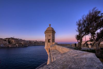 View of historical building against clear blue sky