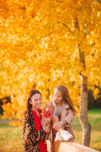 Young woman smiling during autumn