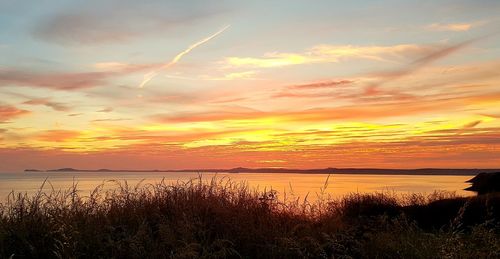 Scenic view of sea against sky during sunset