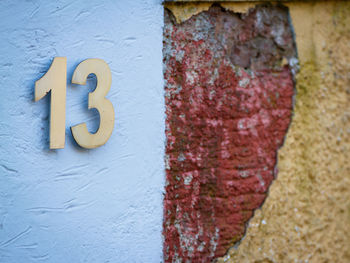 Close-up of text on brick wall