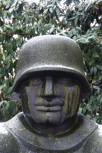 Close-up of statue against trees