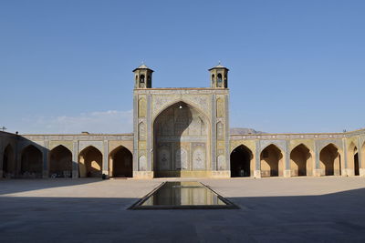 View of historical building against clear blue sky