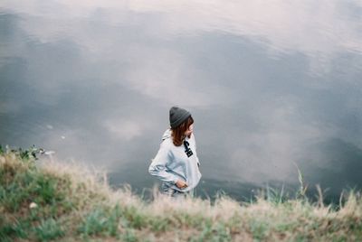 Woman on field against sky