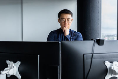 Young woman using laptop at office