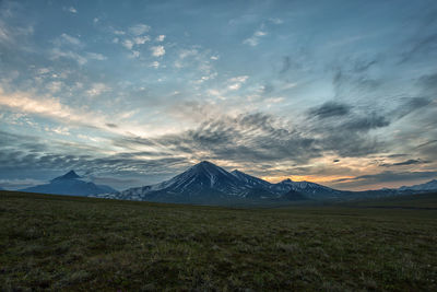 Scenic view of field against sky during sunset