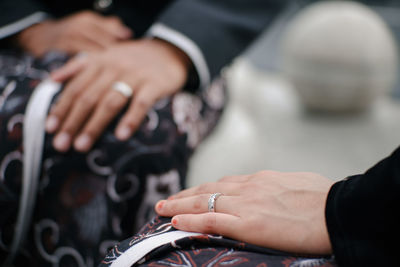 Close-up of people holding hands