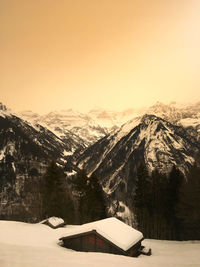 Scenic view of snowcapped mountains against sky during winter