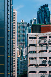 Modern buildings in city against sky