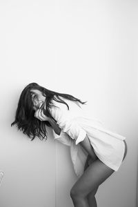 Side view of a woman against white background