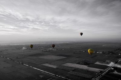 Airplane flying over cloudy sky