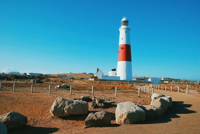 Lighthouse against clear blue sky