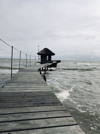 Pier over sea against sky