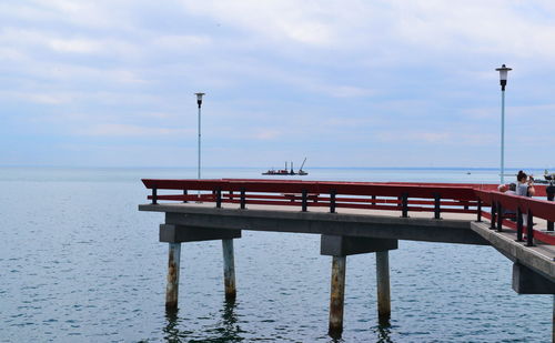 Pier over sea against sky