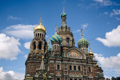 Low angle view of building against cloudy sky