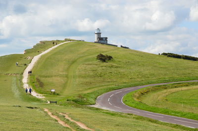 Scenic view of green landscape against sky