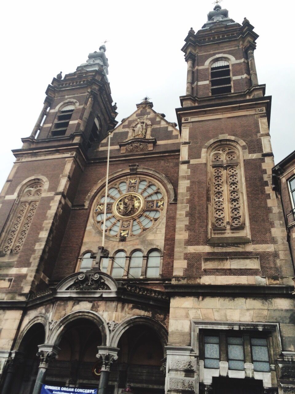 architecture, low angle view, building exterior, built structure, arch, religion, facade, history, church, clear sky, window, sky, travel destinations, place of worship, day, no people, outdoors, old