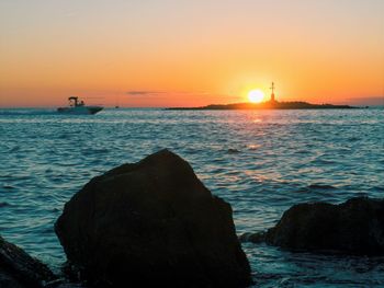 Scenic view of sea against sky during sunset