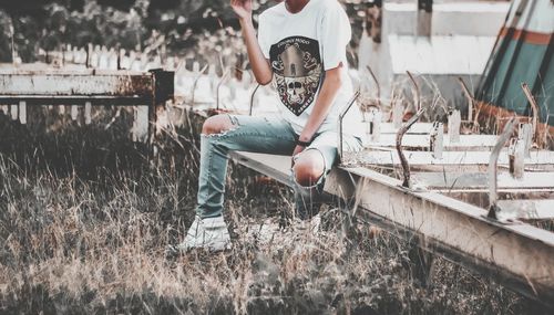 Low section of man standing in forest