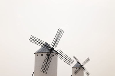 Low angle view of spanish traditional white windmill against clear sky