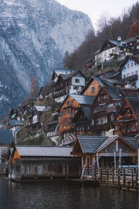 Houses by river in town