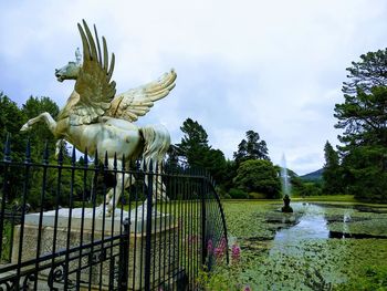 View of birds on lake against sky