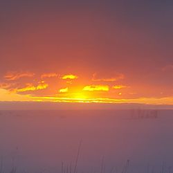 Sunset over calm sea