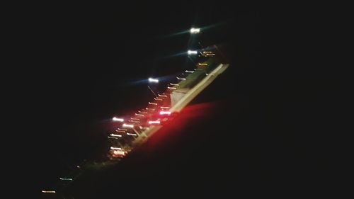 Low angle view of illuminated sky at night