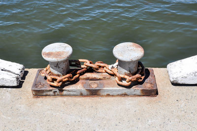 High angle view of rusty metal in lake