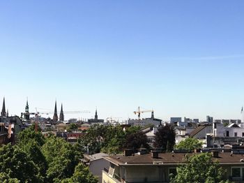 Cityscape against clear sky