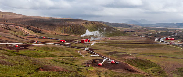 High angle view of vehicles on road against sky