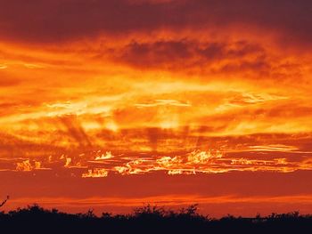 Low angle view of dramatic sky during sunset