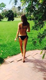 Rear view of woman standing in park