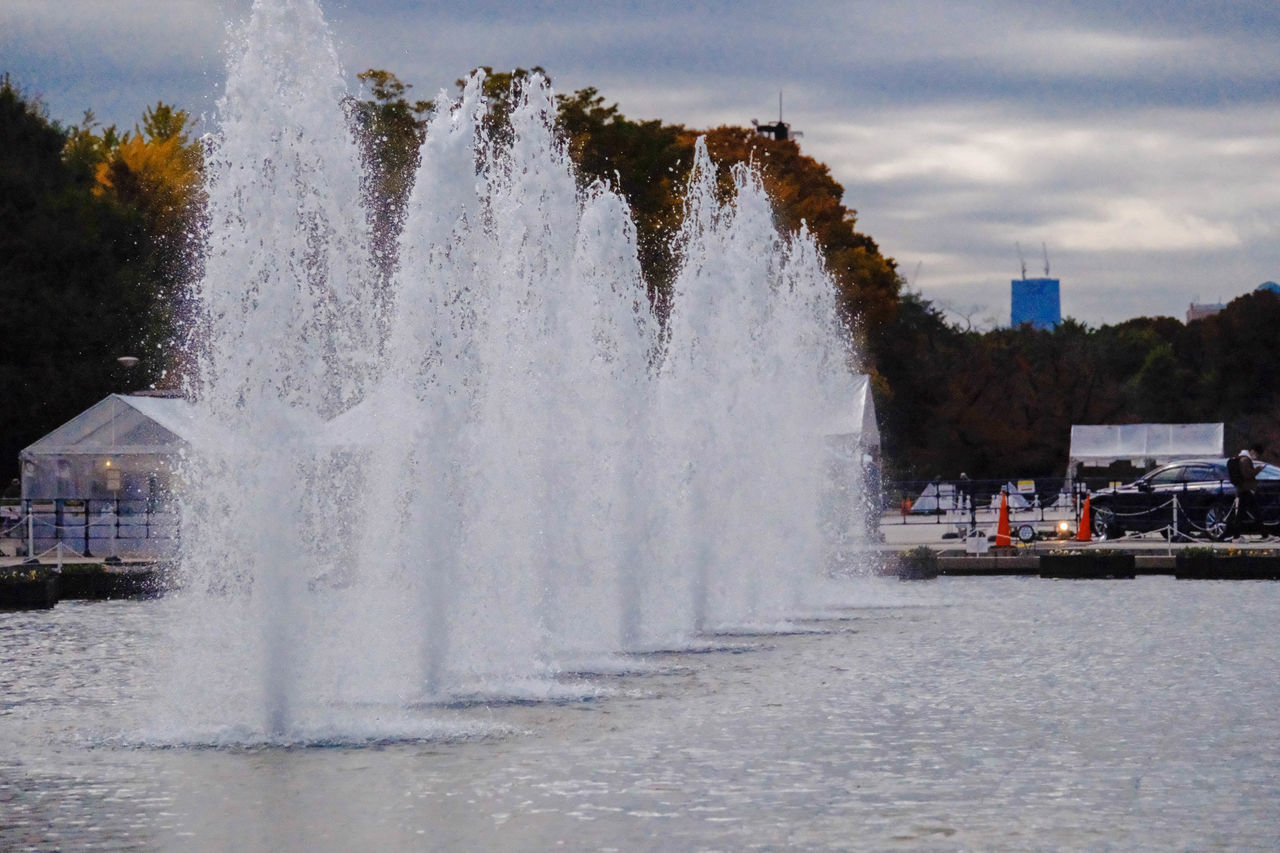 water, motion, architecture, fountain, nature, spraying, splashing, winter, body of water, built structure, sky, cloud, outdoors, tree, water feature, sea, day, freezing, building exterior, city, no people, travel destinations