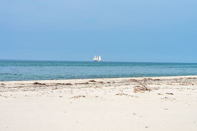 Scenic view of beach against clear sky