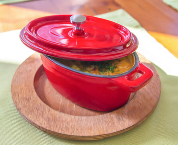 High angle view of red tea cup on table