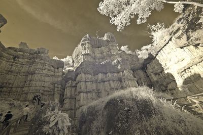 Low angle view of rock formation against sky