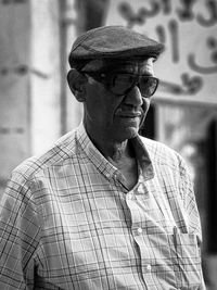 Portrait of old man wearing hat