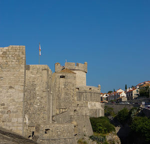 Low angle view of fort against blue sky