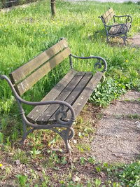 Empty chairs on grass