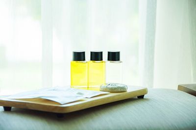 Close-up of bottles with tray on table