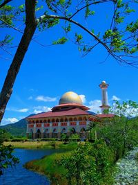 View of temple against blue sky