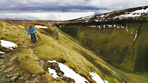 Man riding bicycle on mountain