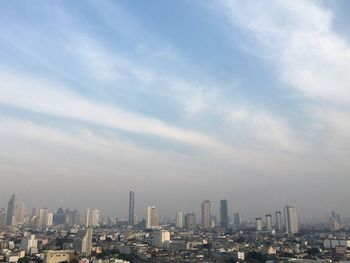 Modern buildings in city against sky