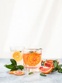 Hard seltzer cocktail with blood orange. cocktail or lemonade with citrus. low alcohol mocktails. 