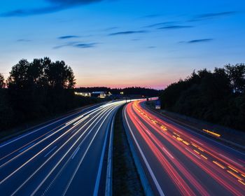 Light trails on highway at dusk