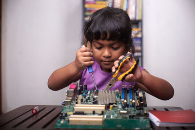 Portrait of boy playing at home