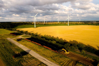 Scenic view of farm against sky