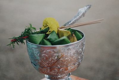 Close-up of leaves in container on table