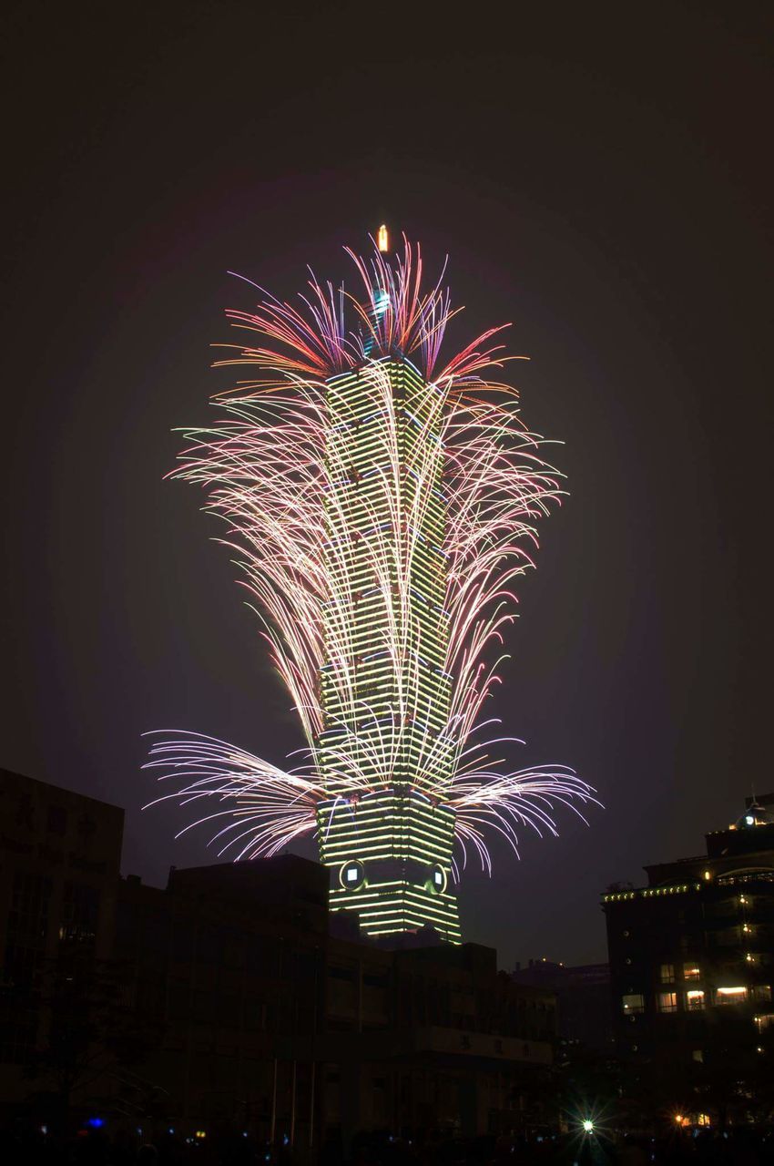 night, illuminated, firework display, celebration, exploding, firework - man made object, low angle view, long exposure, building exterior, arts culture and entertainment, built structure, architecture, motion, glowing, sparks, event, sky, multi colored, firework, entertainment
